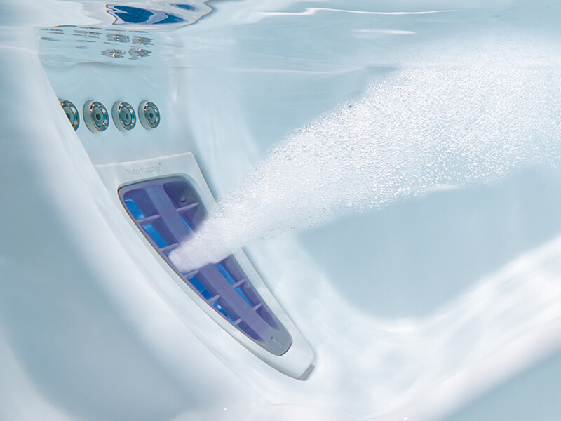 Image showcasing Hot Spring Spa's hot tub's jet system designed to provide a comprehensive massage experience, from neck to feet.